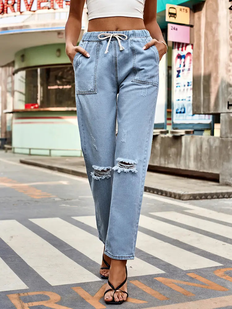Hierscht-Jeans mat Schnërcelen um Tailleband a gebrauchte Look