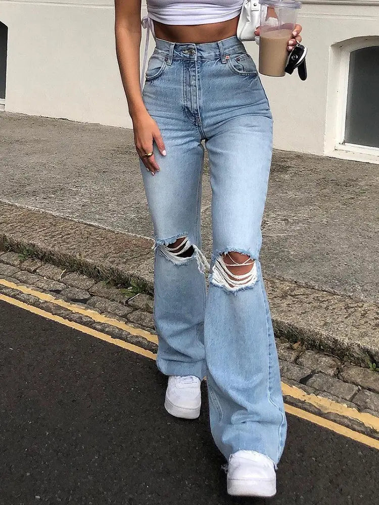 Jeans acampanados desgastados de pierna ancha