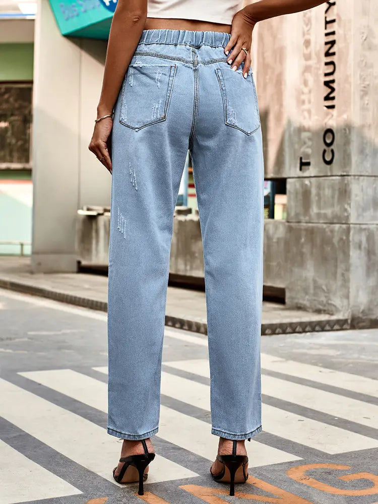 Hierscht-Jeans mat Schnërcelen um Tailleband a gebrauchte Look
