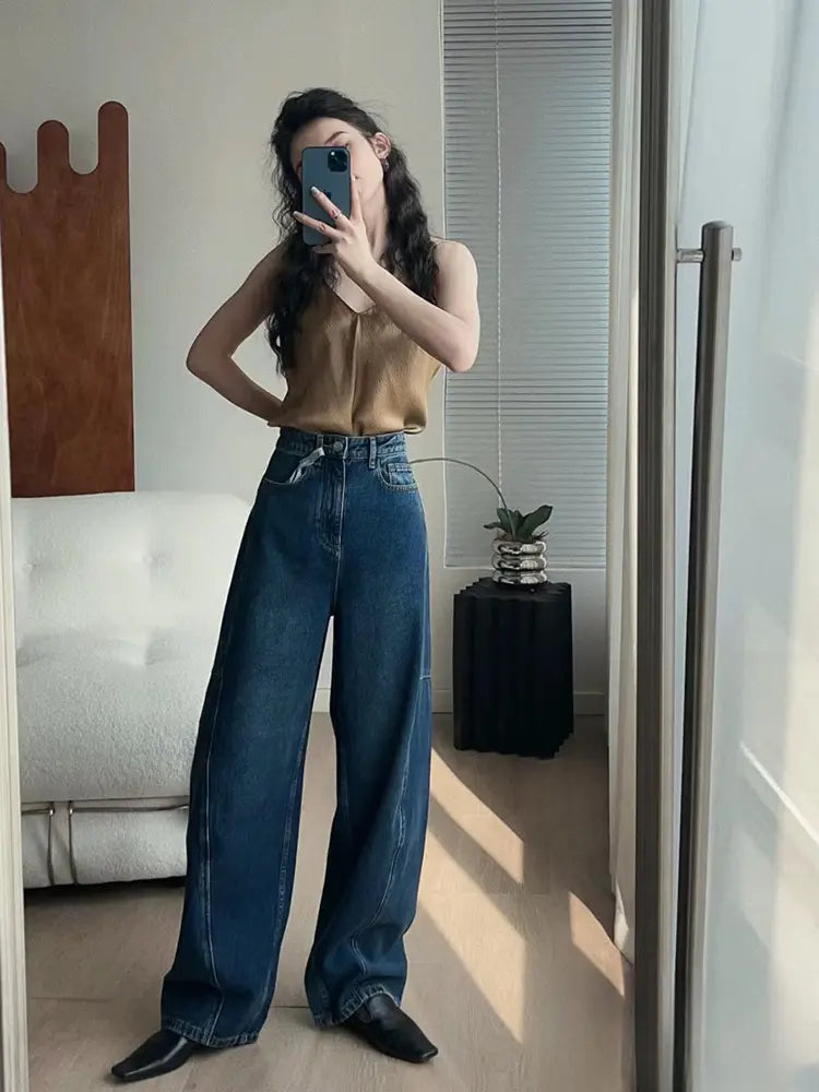 Pantalones de mezclilla sueltos con corte en arco a la moda