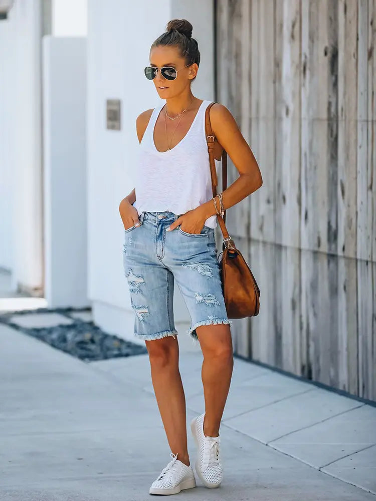 Shorts di jeans slim fit consumati con orlo sfrangiato