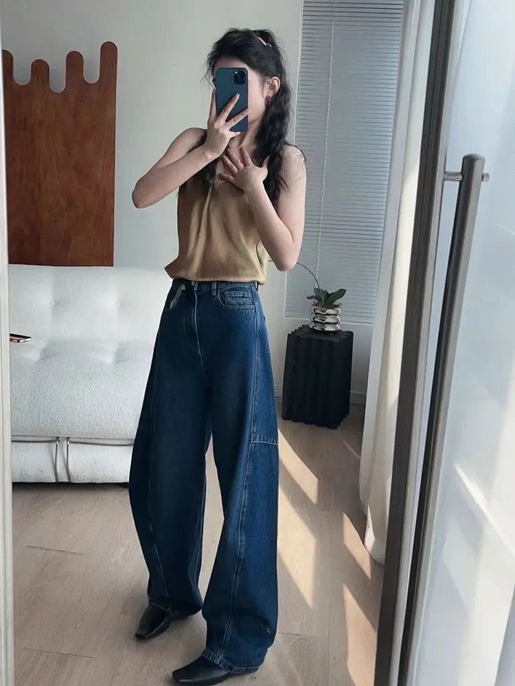 Pantalones de mezclilla sueltos con corte en arco a la moda