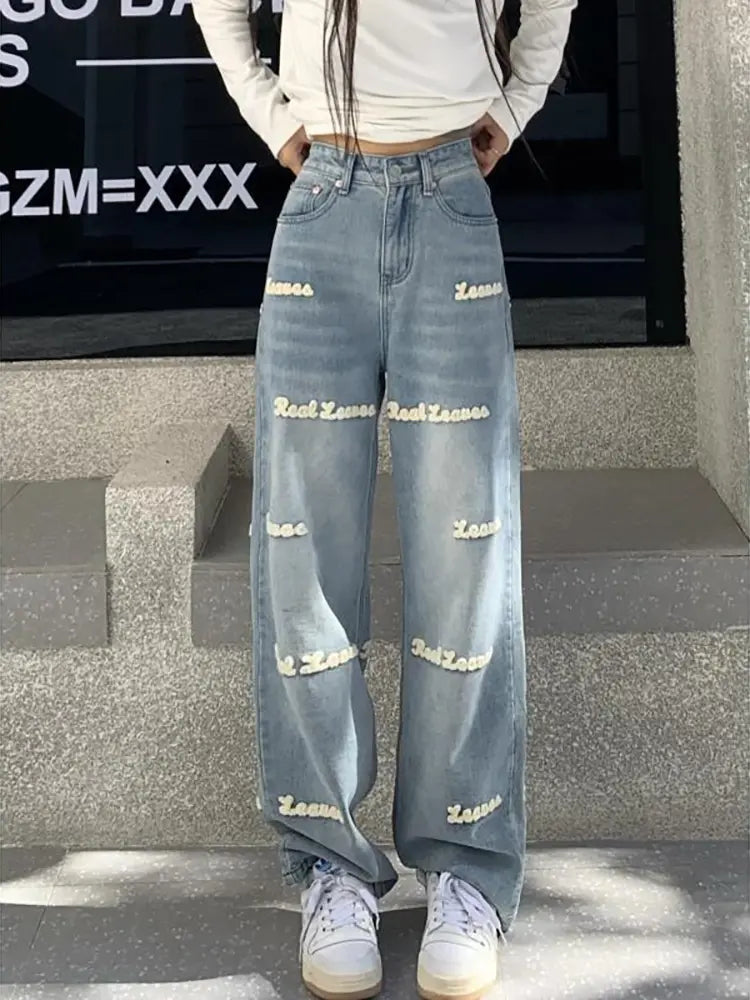 Jeans a vita alta ricamati