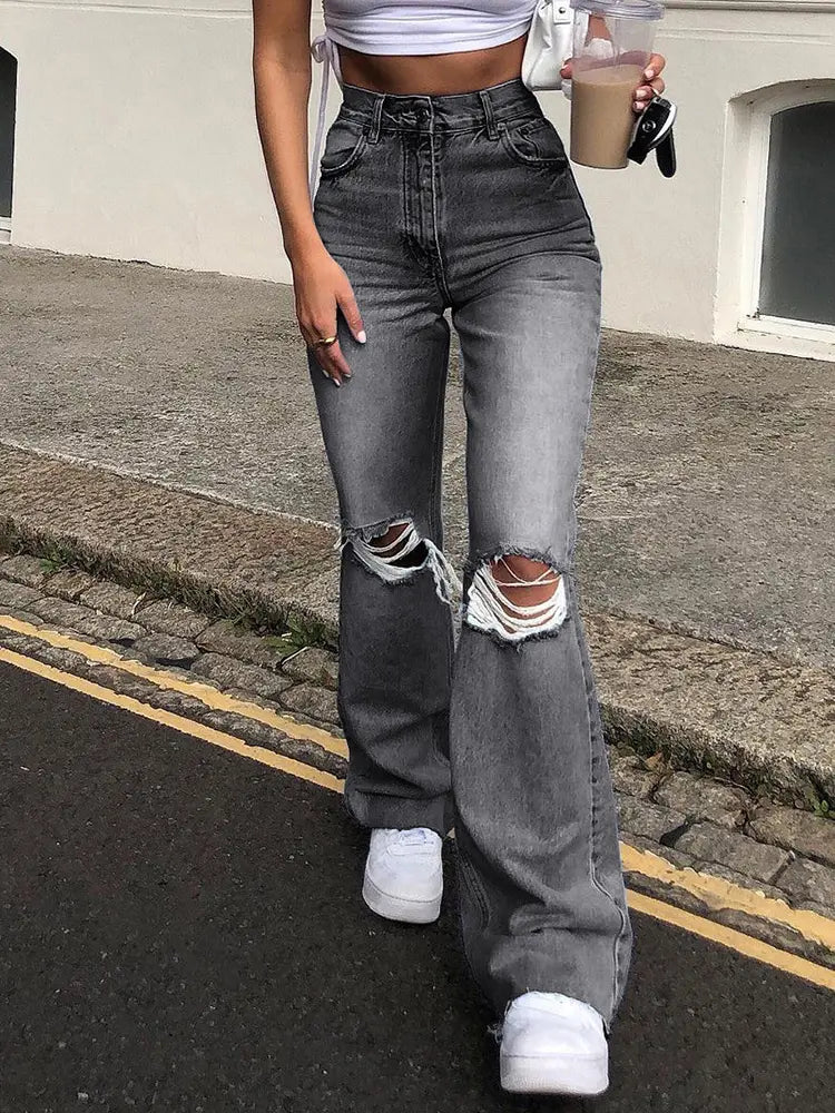 Jeans acampanados desgastados de pierna ancha