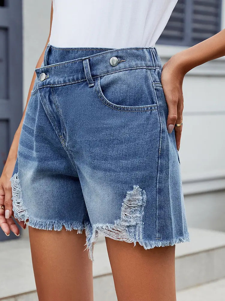 Shorts estivi asimmetrici in denim con frange